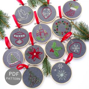 12 embroidery holiday ornaments stitched on dark fabric inside 3-inch hoops