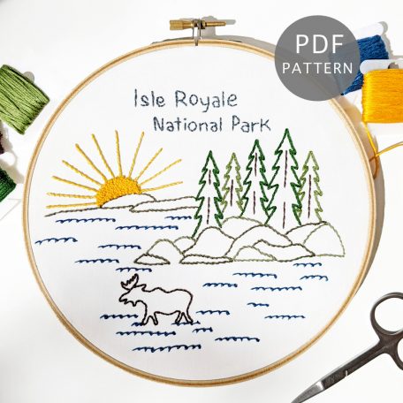 Isle Royale Hand Embroidery Pattern stitched on white fabric inside a 7-inch wooden hoop
