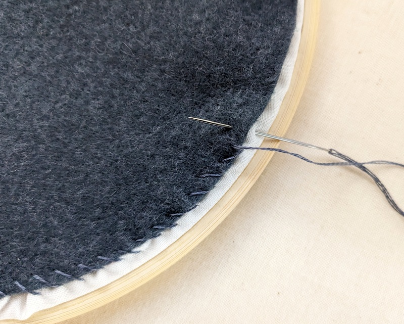 Attatch the backing felt with a whip stitch.